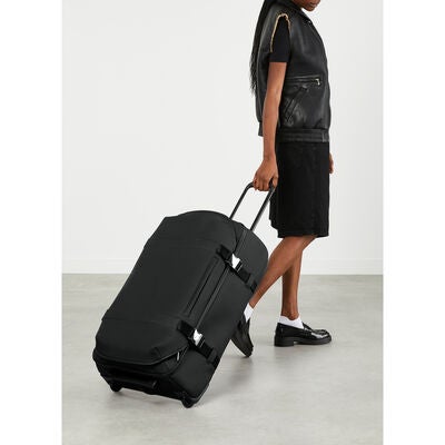 Lost In Berlin Exile Wheeled Duffel in the color Black.