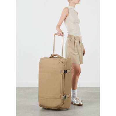 Lost In Berlin Exile Wheeled Duffel in the color Sandstone.