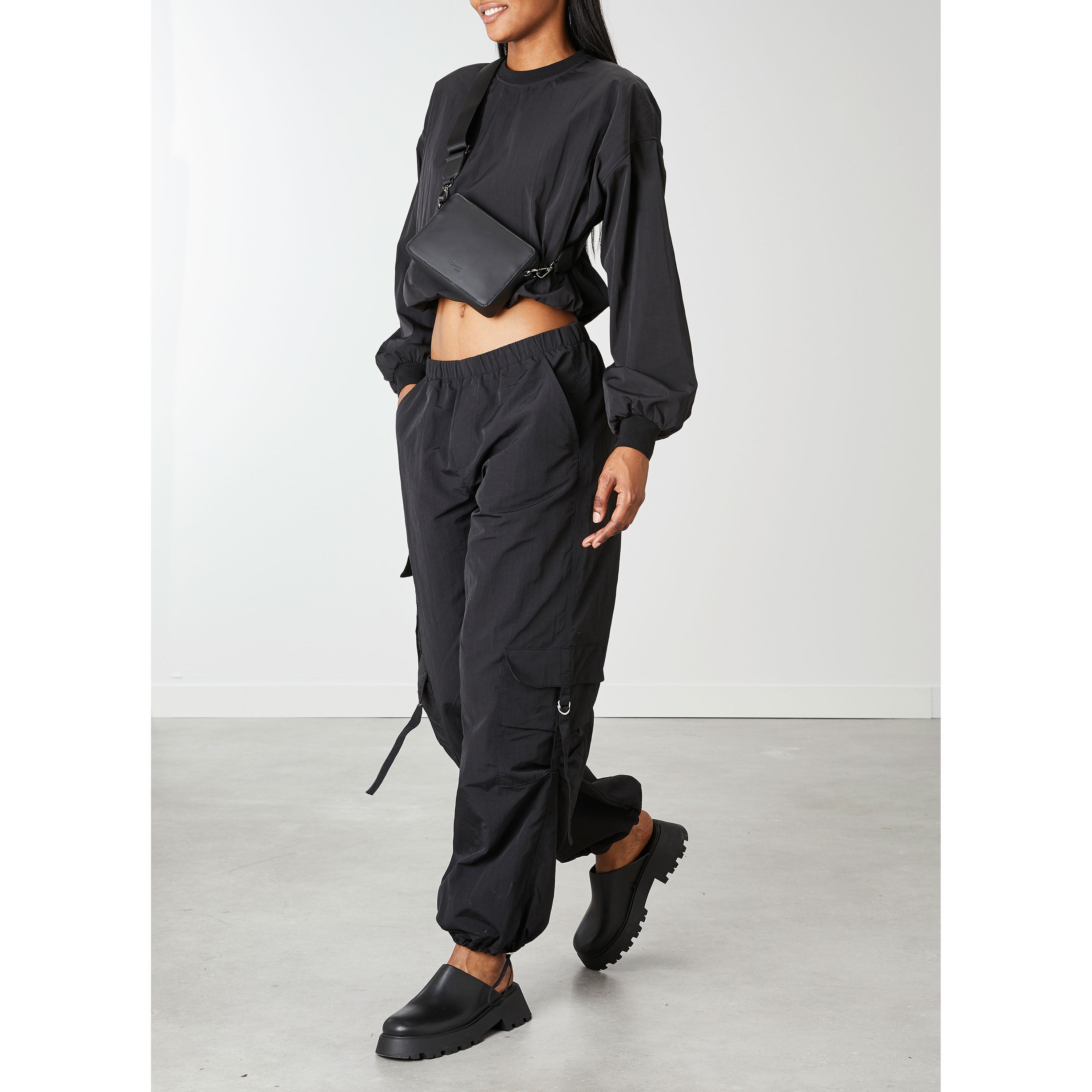 Lost In Berlin Crossbody Bag in the color Black. image number 5