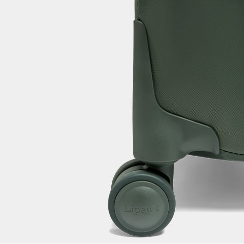 Up close shot of the double spinner wheels on the Plume suitcases.