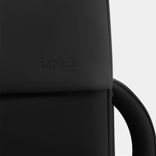 Up close shot of the debossed Lipault logo on the Lost in Berlin collection.